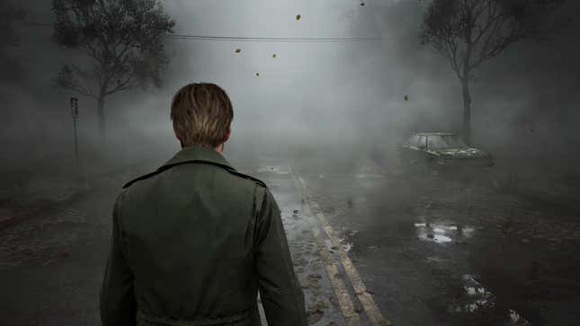 James walks through a foggy Silent Hill. 