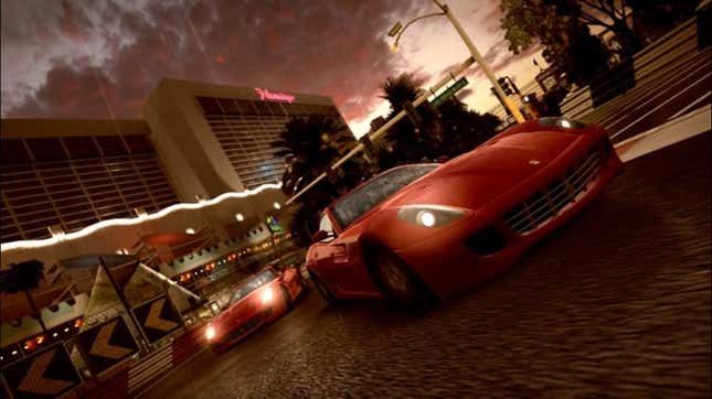 A red sports car races at night. 