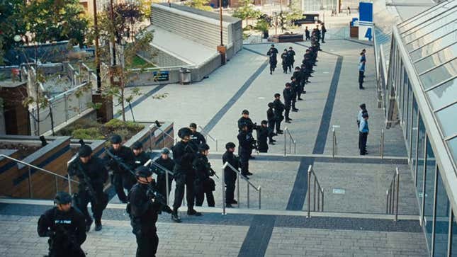 Dozens of police officers stand outside the concert. 